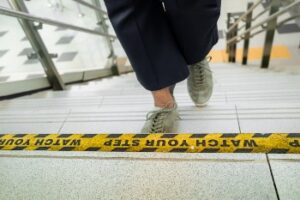 Warning sign on steps to prevent accidents